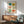 Nostalgic kitchen poster with Japandi minimalist aesthetic: ceramic vessels and blooming flowers in soft cream, coral, sage, and teal creating warm cottage home decor.