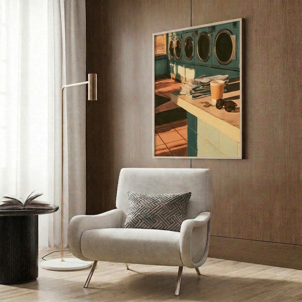 Framed print featuring a retro laundromat scene with sunlit windows, cream and warm gold color palette, celebrating vintage everyday life with peaceful, contemplative mood.