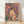 Whimsical boho folk art poster featuring a hare surrounded by wildflowers under a luminous moon, rendered in warm mauve, coral, cream, and gold tones with a nostalgic retro aesthetic.