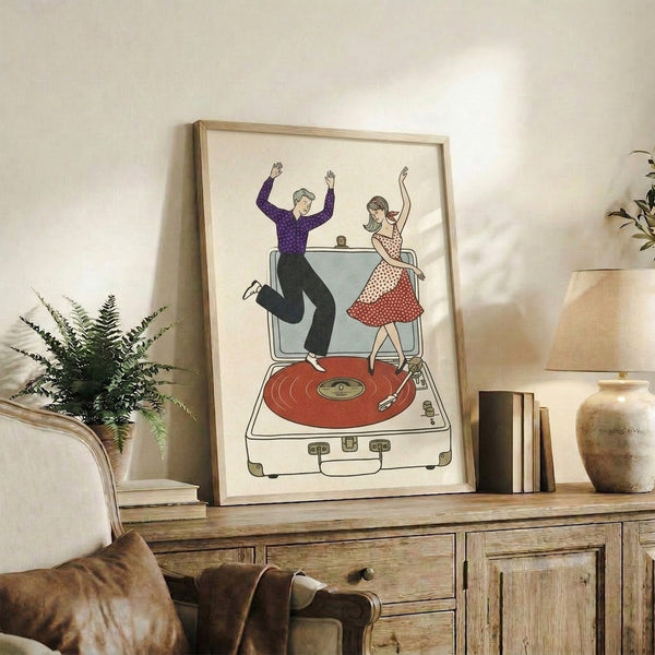 Retro wall art print with line-drawn couple dancing joyfully beside a vintage turntable and vinyl collection, featuring warm cream and deep red tones with nostalgic flair.