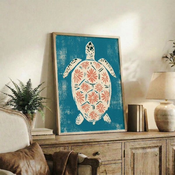 Peaceful coastal-inspired linocut print showing a decorative sea turtle and botanical motifs in navy, teal, and coral hues, framed wall art.