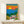 Nostalgic minimalist wall art print showing a classic Beetle automobile driving along a seaside route during golden hour, with whimsical flowers and rocks framing the scene in vibrant retro color palette.