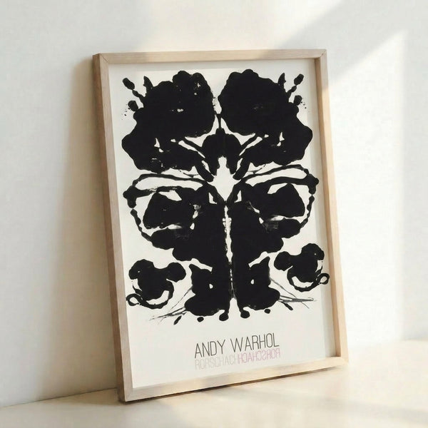 Abstract framed art print displaying a symmetrical Rorschach-inspired ink blot with dynamic pop art coloring and contemporary aesthetic.