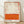 Abstract minimalist poster with horizontal cream and burnt orange color fields, evoking contemplative mood through soft, layered hues.