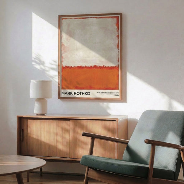 Minimalist framed art featuring cream, burnt orange, and red abstract color fields arranged horizontally, evoking contemplative mood.