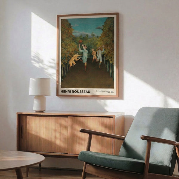 Framed poster of Rousseau's whimsical The Football Players, a 1908 masterpiece blending playful figures and foliage in soft, muted earth tones and cool teals within folk art tradition.
