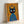Pop art wall print showcasing a black cat with an ornate crown in a bold, humorous composition using vivid orange, red, and blue colors.