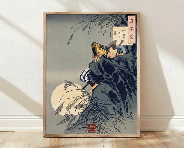 Framed Japanese woodblock-style poster featuring a solitary samurai climbing a moonlit cliff with katana, willow tree, and full moon in cream, dark blue, and gold tones creating a dramatic, contemplative atmosphere.