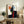 Abstract expressionist framed poster with freeform shapes and spontaneous brushwork in red, blue, and black tones on a neutral background.