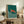 Serene oceanic poster showing a rust-colored turtle swimming through teal and cream waves, inspired by traditional woodblock printmaking techniques.