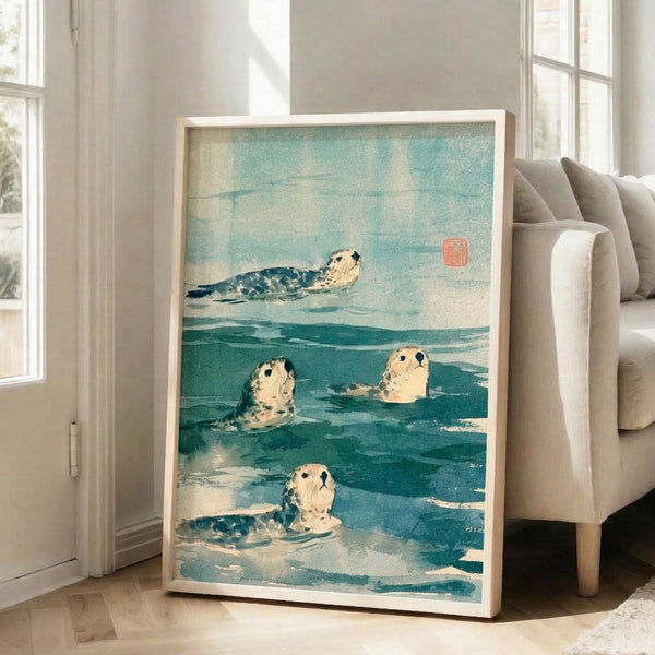 Vintage-inspired poster art showing seals in their ocean habitat, painted in muted teal, cream, and black tones with the observational quality of classical Japanese printmaking.