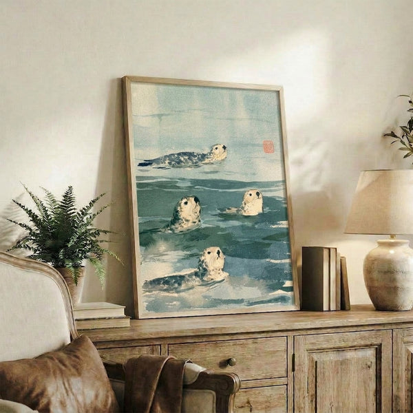 Framed wall art print featuring graceful seals in calm waters, combining teal and pale blue hues in a serene Japanese aesthetic with naturalistic detail and vintage charm.