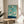 Minimalist watercolor poster depicting seals in an ocean scene with sage green and turquoise hues, evoking tranquil Japandi wall decor sensibility.
