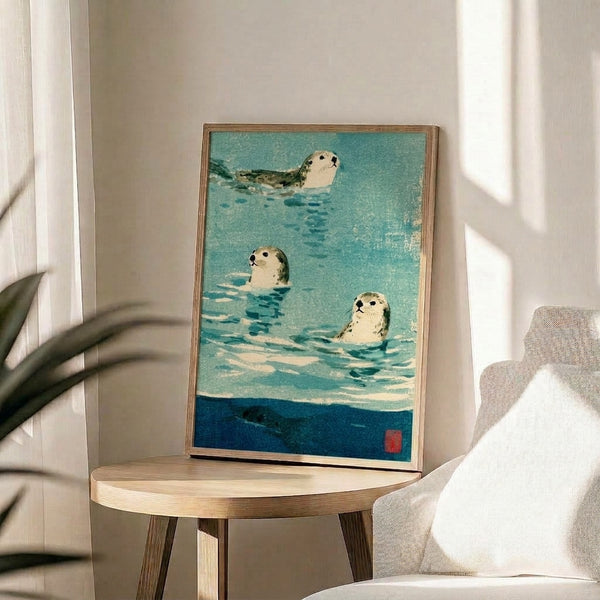 Minimalist watercolor poster depicting seals in an ocean scene with sage green and turquoise hues, evoking tranquil Japandi wall decor sensibility.