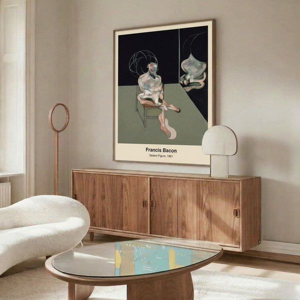 Solitary figure in a chair depicted through distorted, expressionistic abstraction in muted greys and ochres; modern wall art print in frame.
