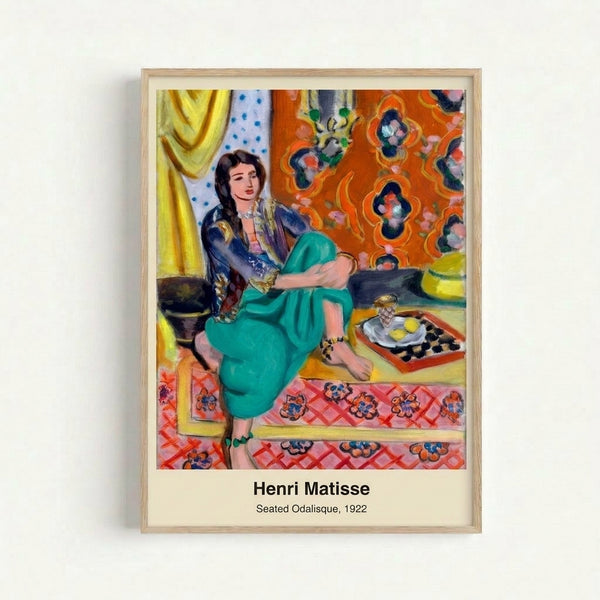 Framed poster of Matisse's Seated Odalisque showing a reclining woman rendered in sophisticated Art Nouveau style with warm ochre and cool blue palette.
