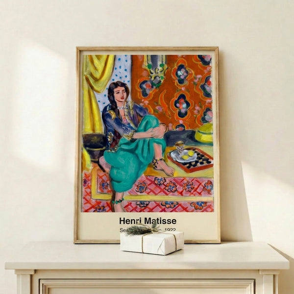 Matisse-inspired modern art print of a contemplative seated woman with flowing lines and a sensual palette of ochre, blue, and neutral tones.