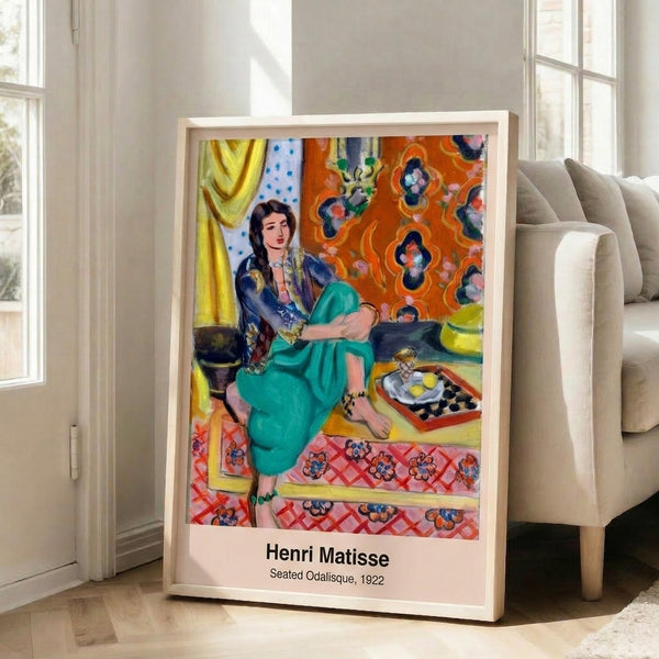 Framed modern art poster featuring Matisse's iconic odalisque figure in minimalist design with sophisticated ochre, blue, black, and cream color scheme.
