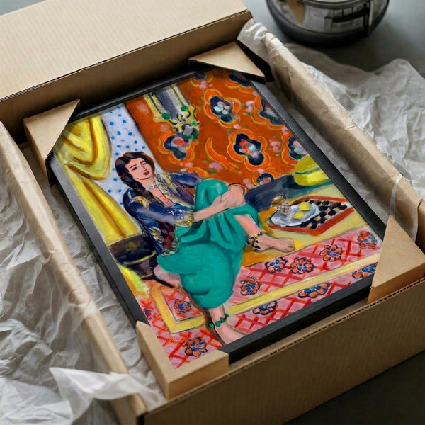 Contemporary wall art depicting a seated odalisque in warm russet and navy tones, balancing figurative representation with abstract decorative surface design.