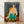 Framed art print of a reclining figure in relaxed pose against patterned background, rendered in bold flattened forms with vibrant jewel tones and decorative motifs.