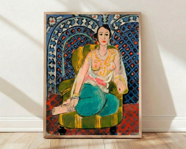 Framed art print of a reclining figure in relaxed pose against patterned background, rendered in bold flattened forms with vibrant jewel tones and decorative motifs.