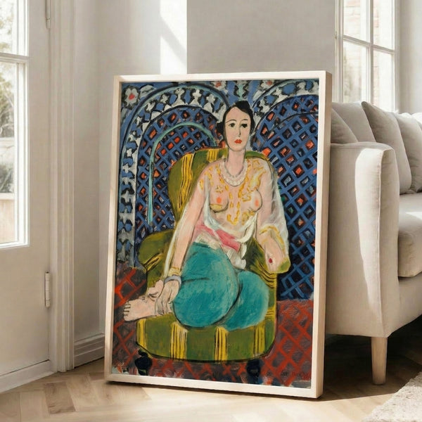 Framed contemporary art print showing an elegantly posed woman amid swirling patterned backgrounds in vibrant coral, teal, and gold tones.
