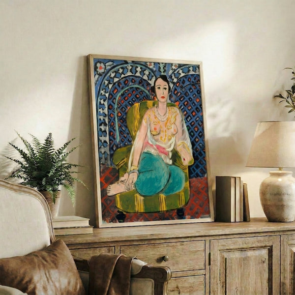 Abstract-influenced portrait of a seated figure in flowing dress, set against layered patterned designs in warm and cool colors, presented as a gallery-quality poster.