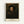 Dignified self-portrait featuring a figure in ochre and brown hues against dark shadowing, displayed as a framed wall print with introspective mood.