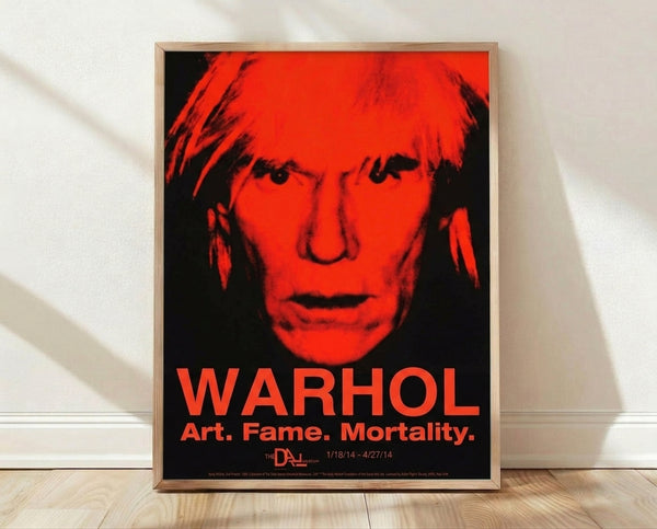Abstract pop art self-portrait in bold red, black, and white silkscreen style, featuring a haunting monumental face with expressive features on framed wall art.