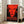 Abstract portrait artwork in striking red and black silkscreen technique, presenting a haunting monumental face ideal for modern wall display.