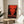 Bold pop art self-portrait in vivid and dark color combinations with distorted facial geometry, framed poster embodying the aesthetic tension between fame and oblivion.