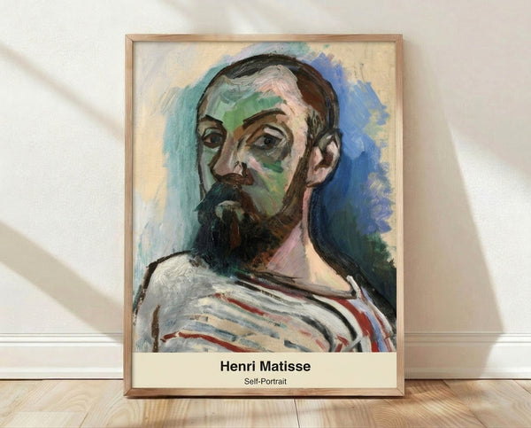 Abstract self-portrait in vibrant color blocks and organic shapes, inspired by Matisse's cut-out technique, displayed as a framed poster on a wall.