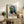 Inventive abstract self-portrait using bold hues and organic shapes layered in a contemporary cut-out style, framed and hung on a wall.