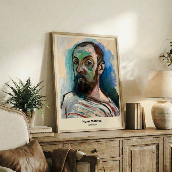 Inventive abstract self-portrait using bold hues and organic shapes layered in a contemporary cut-out style, framed and hung on a wall.