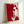 Faceless self-portrait composition in contrasting red and white hues, capturing pop art sensibility with bold graphic forms and contemporary wall presentation.