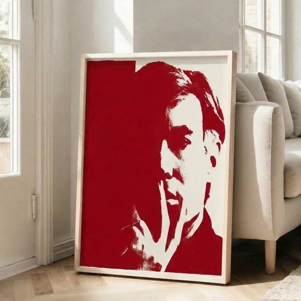 Modern art print depicting a stylized portrait in red and white, executed in flat graphic pop art style and hung as framed wall decor.