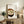 Cozy tangyuan bowl poster rendered in the style of Japanese Showa woodblocks, using a restrained cream and brown palette with minimalist composition for timeless, comforting aesthetic appeal.