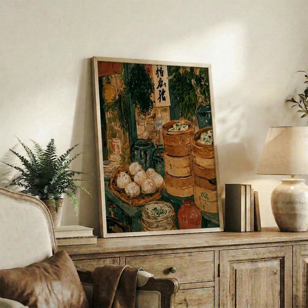 Framed culinary heritage artwork featuring a dim sum steamer market composition with golden-brown bamboo baskets, dumplings, tea service, and ink calligraphy in soft cream and sage green palette.
