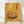 Vintage Japanese woodblock-style poster depicting takoyaki in a steaming pot with chopsticks and bowl, rendered in warm golden yellow, cream, and rust orange tones with nostalgic Showa era charm.