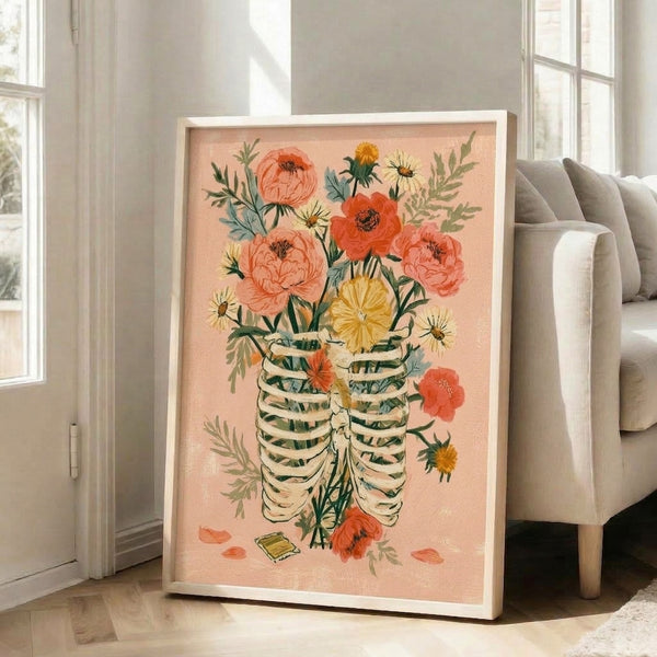 Boho memento mori art print featuring a skeletal ribcage overflowing with soft watercolor flowers and greenery in romantic cottage garden style, rendered in warm blush and coral hues with golden accents.