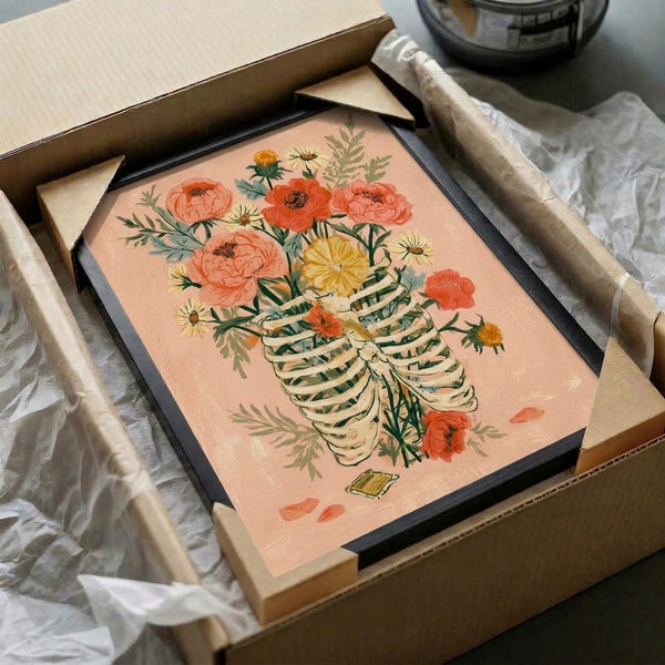 Memento mori framed poster showcasing a delicate ribcage brimming with watercolor peonies, daisies, and garden foliage in soft romantic colors of blush, coral, and golden yellow against a cream backdrop.