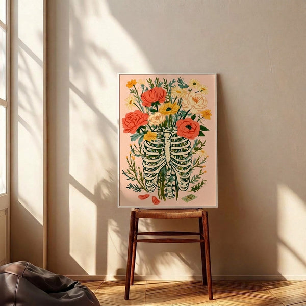 Darkly whimsical watercolor poster of a skeletal ribcage overflowing with delicate flowers in soft pink, coral, and yellow tones, blending boho aesthetics with memento mori themes.