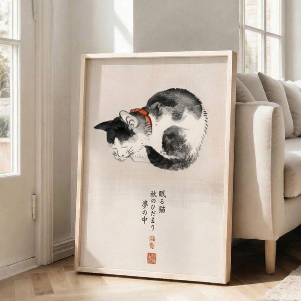 Peaceful woodblock-style cat illustration in cream, black, and orange-red with minimalist composition and Japanese calligraphy, matted and framed as wall decor.