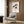 Minimalist framed print of a tranquil cat in cream and gray tones with black outlines and orange-red accents, accented by Japanese calligraphy for peaceful wall display.