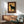 Minimalist retro pop art poster of a sophisticated goat with cigarette and whiskey glass, drawn in geometric lines using a palette of cream, black, rust red, and amber gold.
