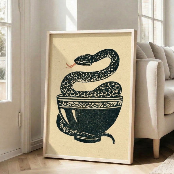 Vintage-style woodblock art featuring a serpent coiled inside a decorative bowl against a cream background with mystical black and teal detailing.
