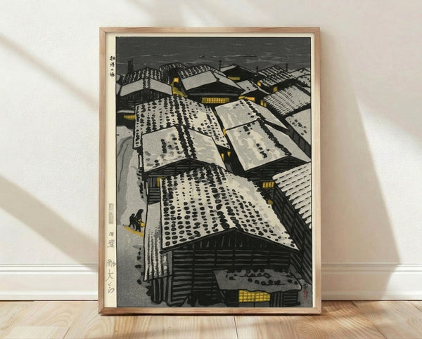Japanese woodblock print depicting snowy rooftops and buildings blanketed in winter snow, with golden lanterns glowing softly against charcoal and cream tones, evoking a serene, contemplative mood.