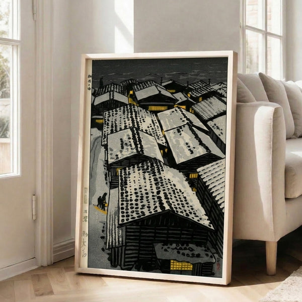 Japanese woodblock artwork portraying a hushed winter landscape of frosted rooftops and buildings, illuminated by gentle lantern light in cream, charcoal, and gold, evoking quiet stillness.