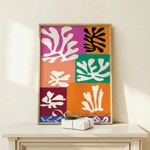 Modern poster featuring abstract botanical forms in muted blues and whites, displayed as framed wall art with a calm, sophisticated aesthetic.