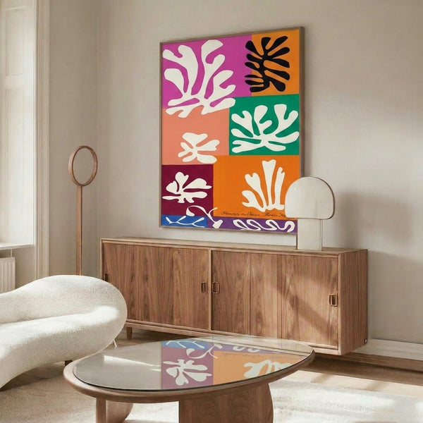 Abstract floral wall art in soft grays, pale blues, and cream tones, showcasing organic botanical forms in a contemporary cut-out style.